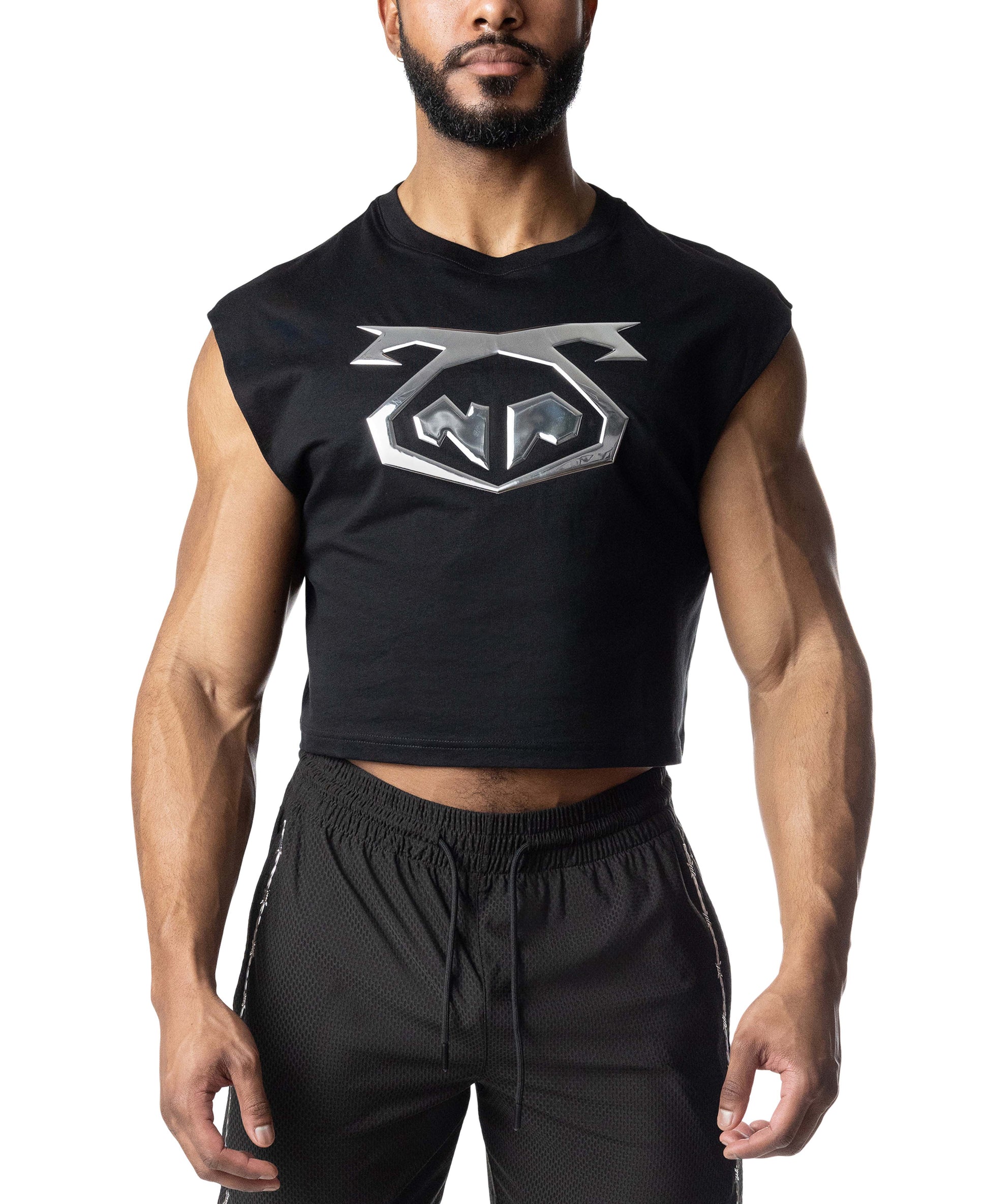Man wearing a black sleeveless shirt with a logo on a white background