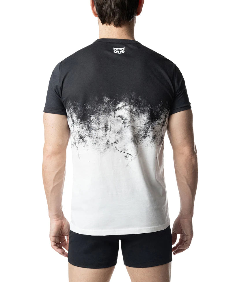 Person wearing a black and white t-shirt with a gradient design on the back.